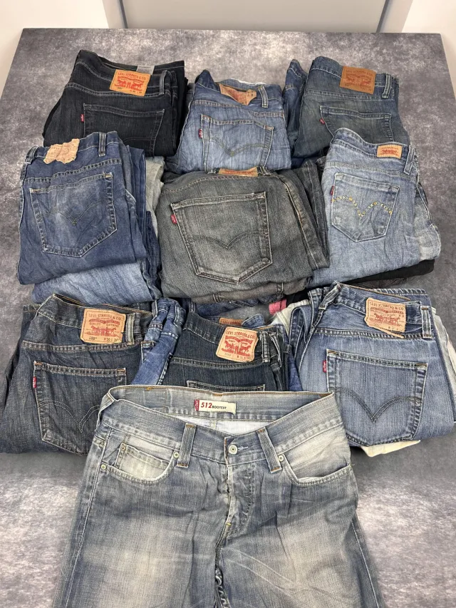 Levi’s jeans from a rag house pickup, laid out in piles