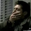 Dean hand over mouth 