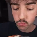 Guy eating cheese